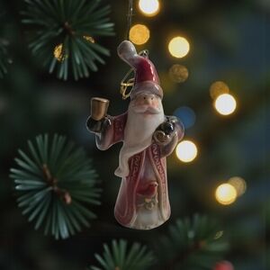 Glazed Ceramic Santa Claus Bell Ornament holding a bell and gift bag 6.25"